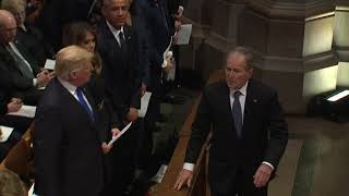 George W Bush sneaks candy to Michelle Obama at Bush funeral [upl. by Hilliard]