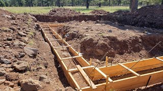 DIY Concrete Forms Forming the foundation footings [upl. by Oicafinob361]