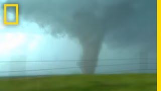 Tornadoes Lightning in Rare Video  National Geographic [upl. by Nileuqaj673]